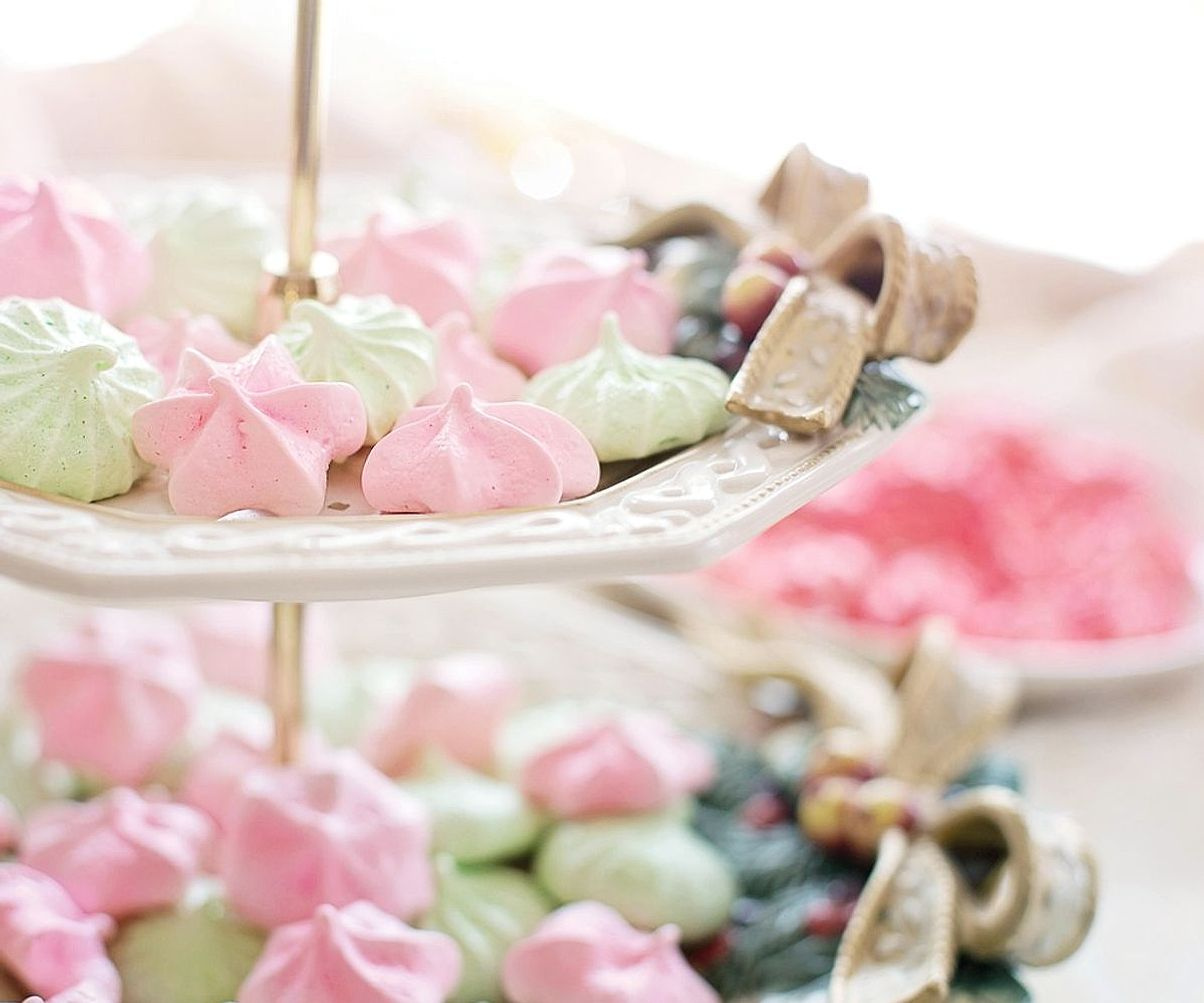 Hands wrapping handmade lollipops at the workbench